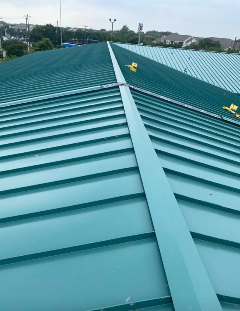 Green commercial metal roof ridge and valley for Metal Roof Repair in Middleton